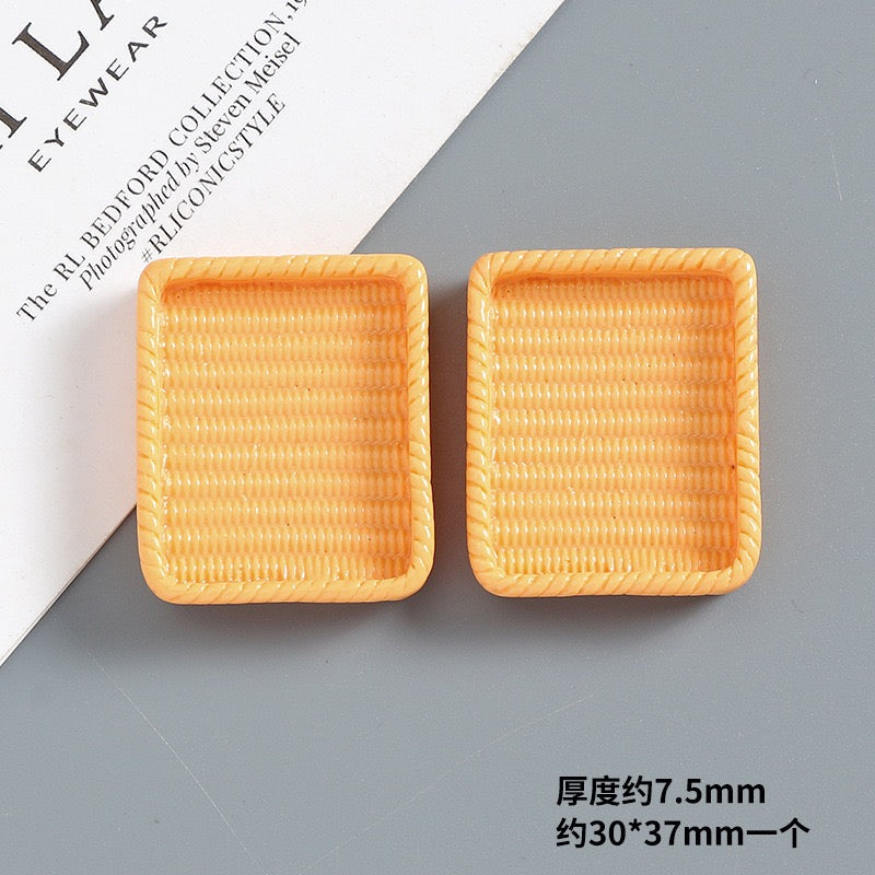 Simulated resin woven basket
