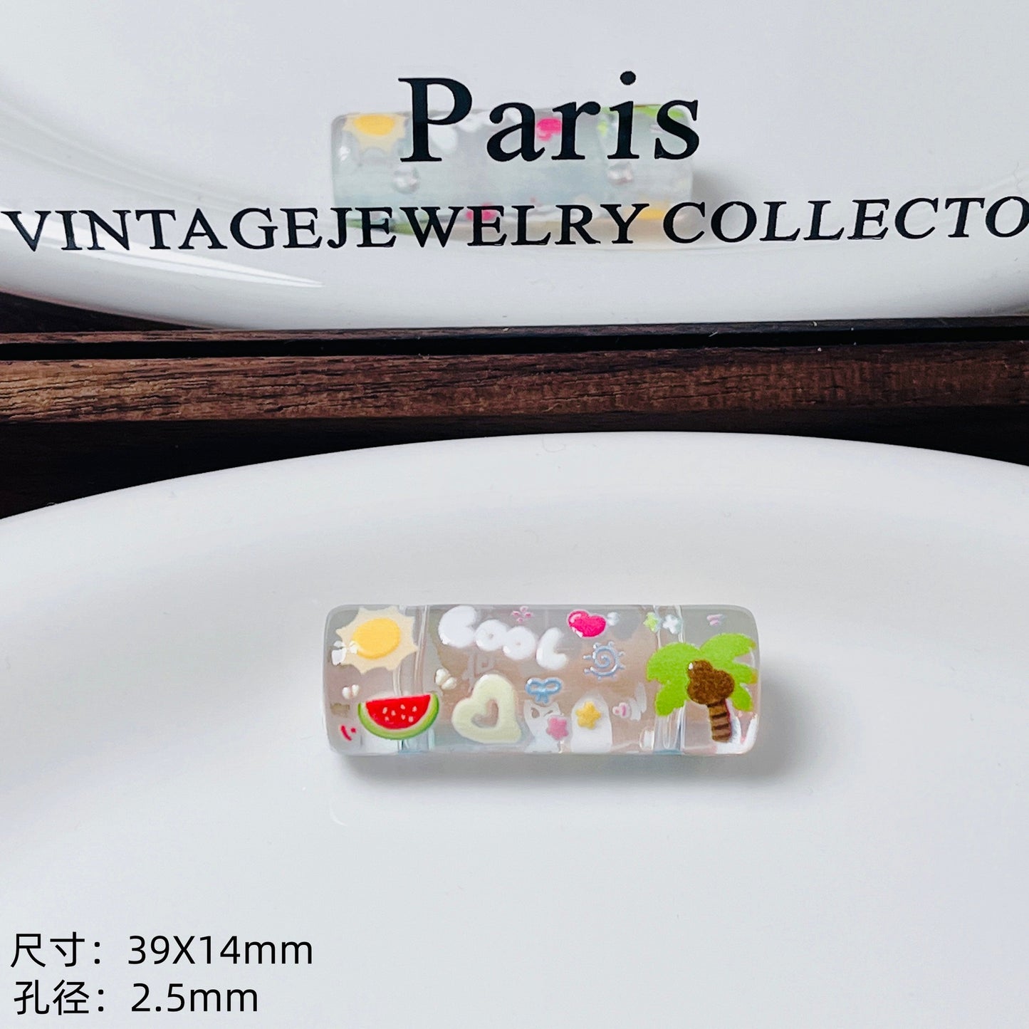 Transparent embossed double-hole cylindrical bead