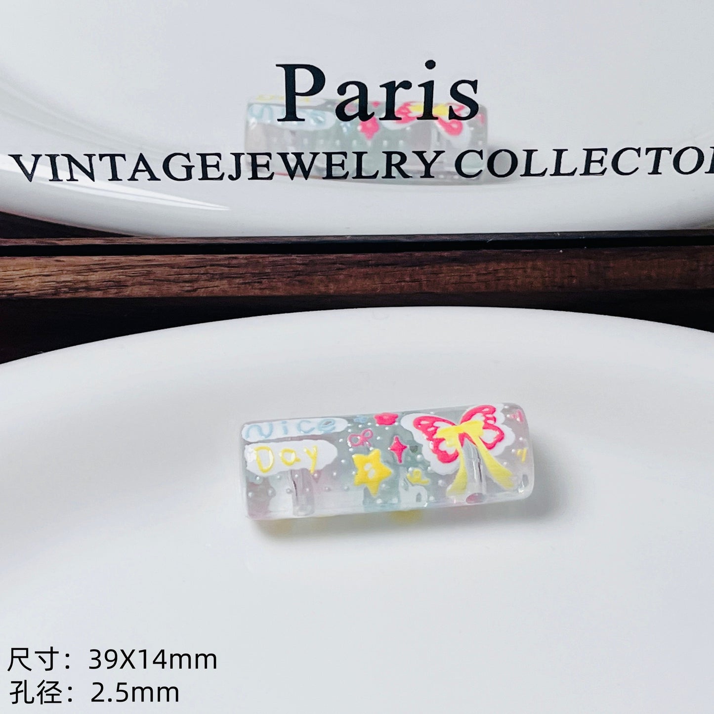 Transparent embossed double-hole cylindrical bead